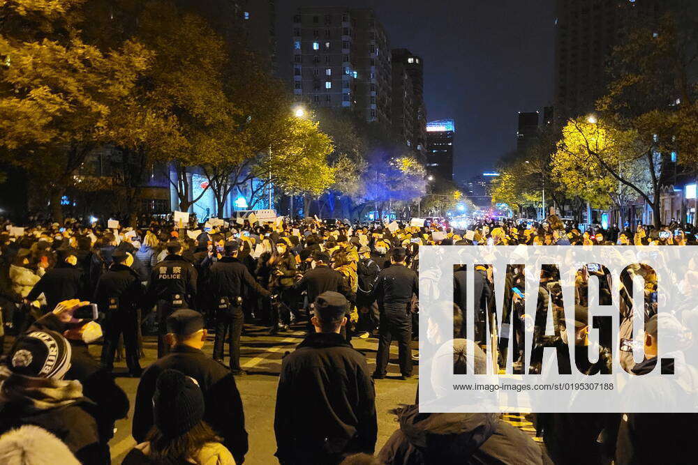 CHINA, BEIJING - : People take part in a protest against COVID-19 ...