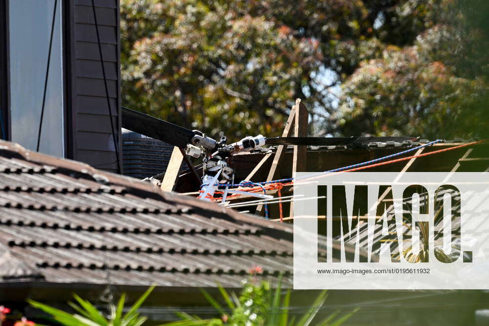 HELICOPTER CRASH MELBOURNE, Pieces of a helicopter are seen on the roof