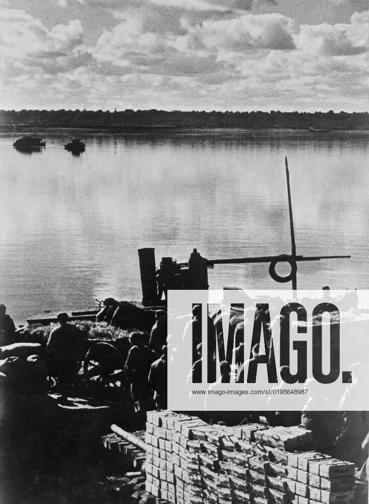 Stalingrad, USSR. 1942. Soviet soldiers cross river with the ammunition ...