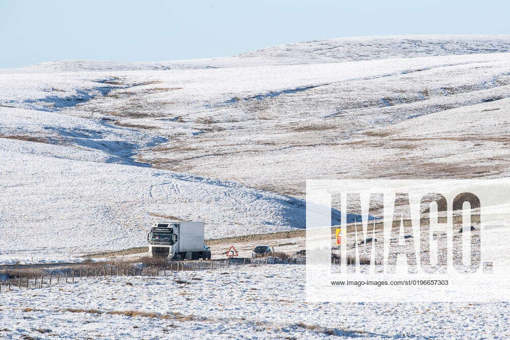 Traffic makes its way through icy conditions along the A628