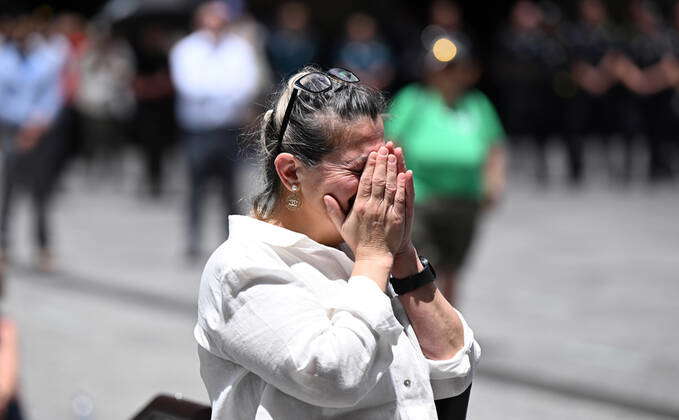 QUEENSLAND POLICE OFFICERS MEMORIAL, A women is seen mourning during ...