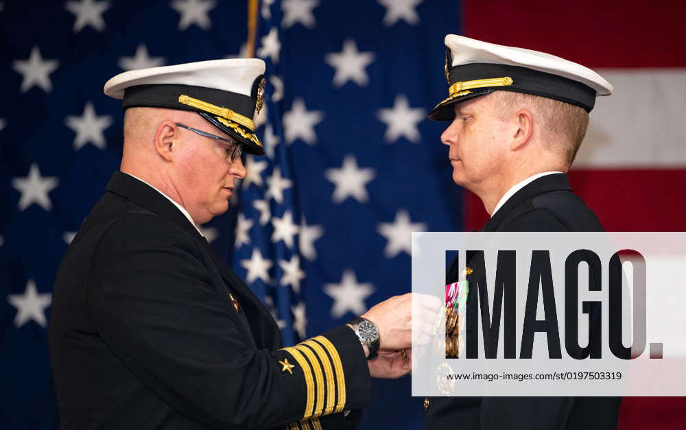 Capt. Brian Freck, right, receives the Legion of Merit award from Capt ...