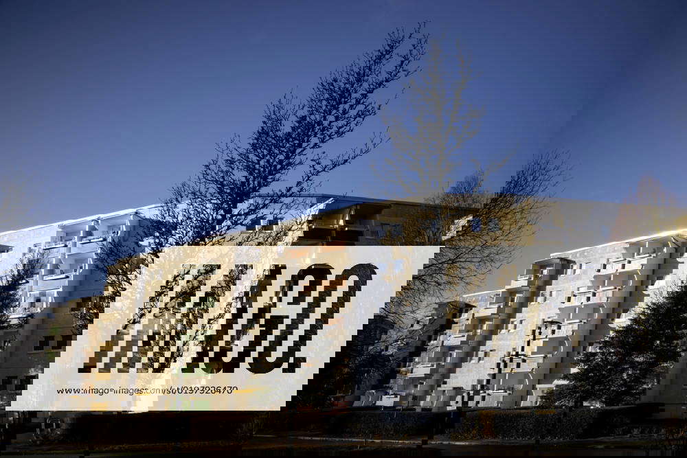 View in the backlight on a block of flats in Rostock new building area