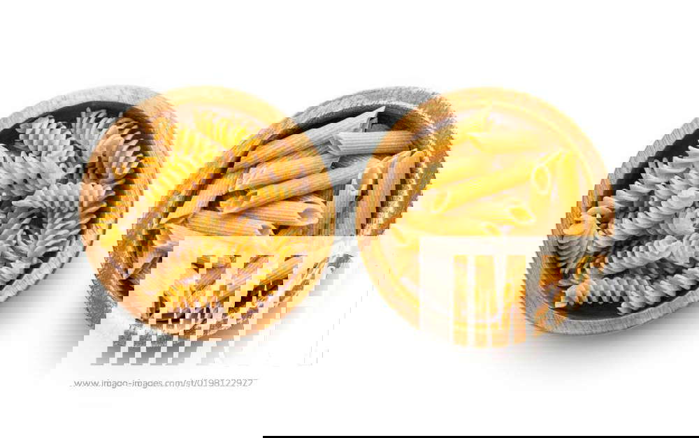 Uncooked Whole Grain Pasta Isolated On White Background Raw Pasta In uncooked-whole-grain-pasta-isolated-on-white-background-raw-pasta-in