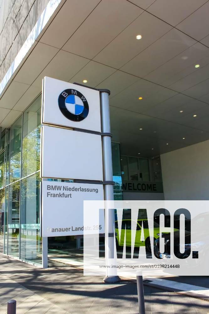 BMW car dealership with cars parked on forecourt., Frankfurt am Main