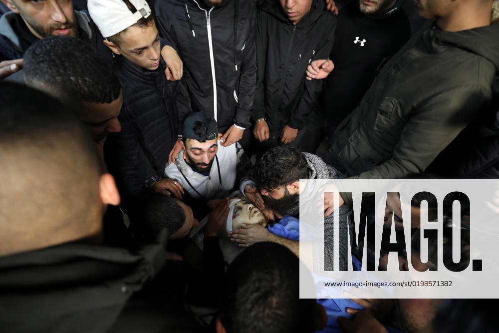 Palestinian Mourners Gather Arround The Body Of Ahmed Amer Salim Abu ...