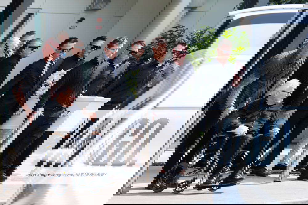 ASHLEY JENKINSON FUNERAL, Friends and family are seen at a funeral