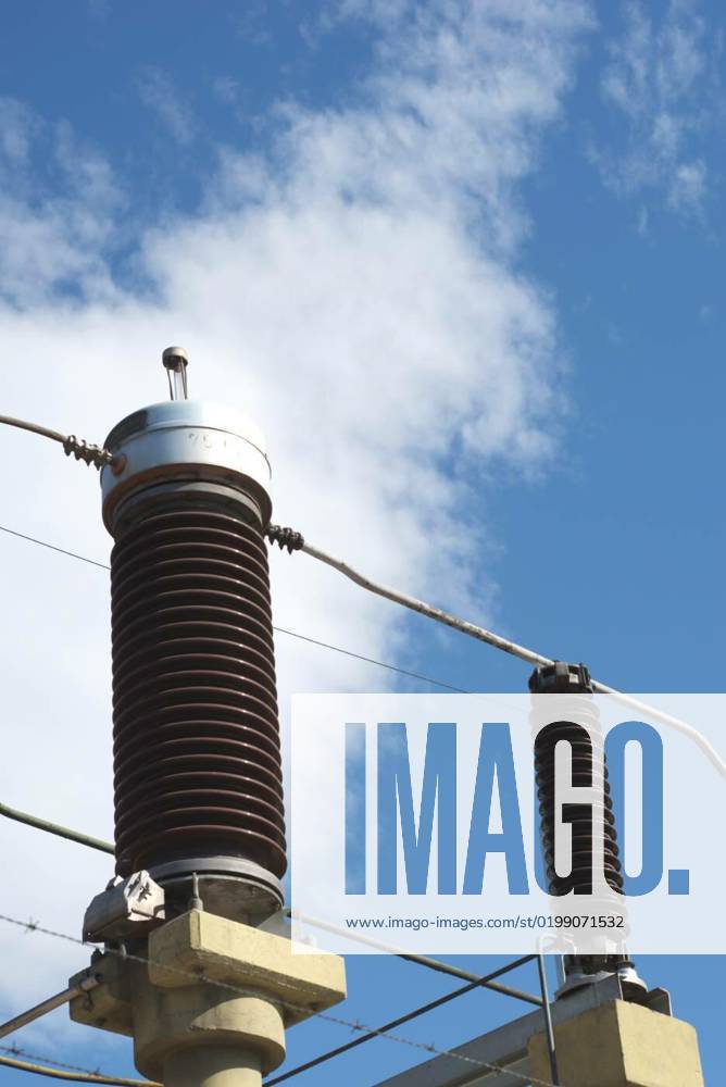 Ceramic insulators on a high voltage power line. Detail close up ...