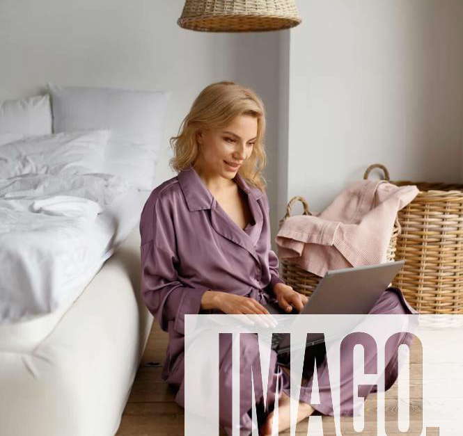 Woman In Silk Pajamas Sleepwear Working On Laptop Sitting On Floor