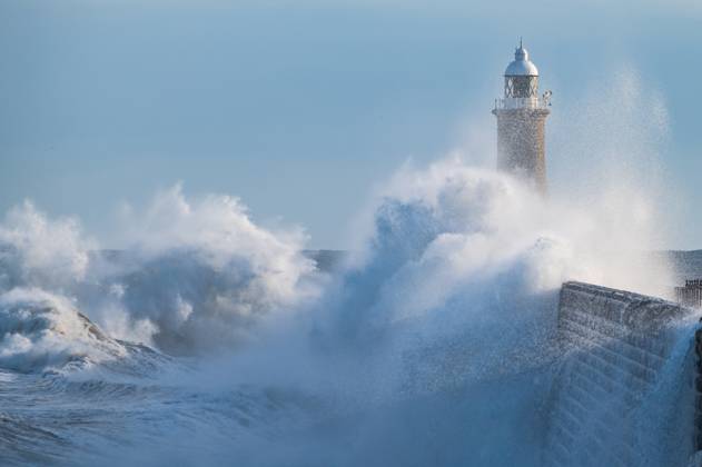 Waves crash against Tynemouth Pier as the UK experiences a range of ...