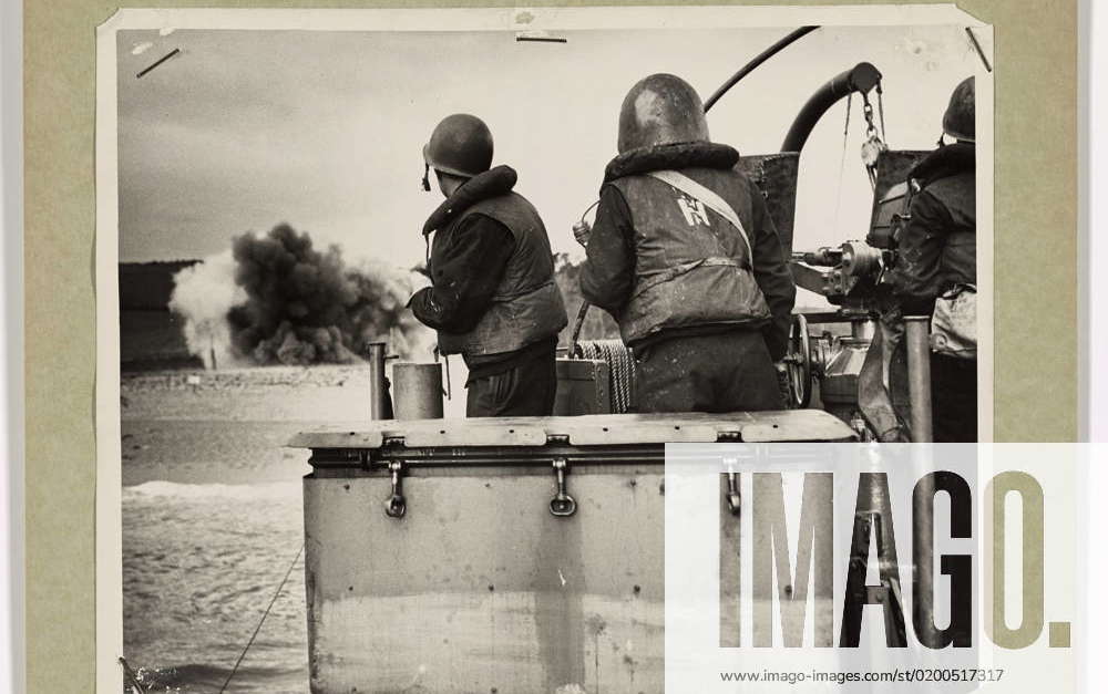 Photograph of Coast Guard Coxswain and Gun Crew Watching as a Nazi Mine ...