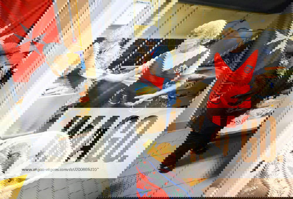 RUSSIA, ST PETERSBURG JANUARY 26, 2023 People receive food in a soup kitchen of Malteser Relief