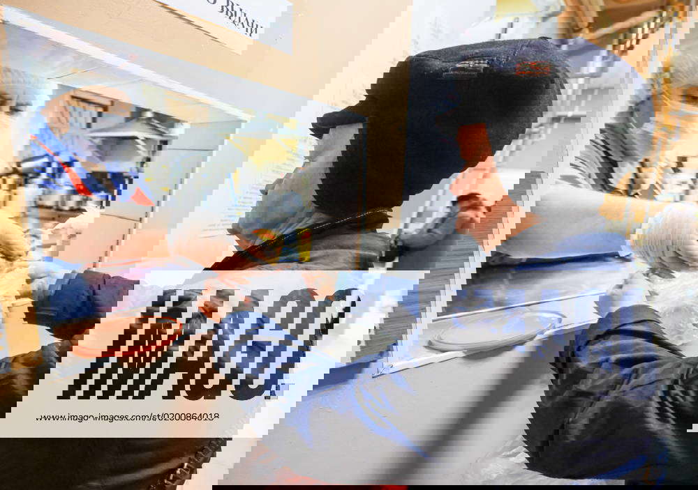 RUSSIA, ST PETERSBURG JANUARY 26, 2023 A woman receives food in a soup kitchen of Malteser