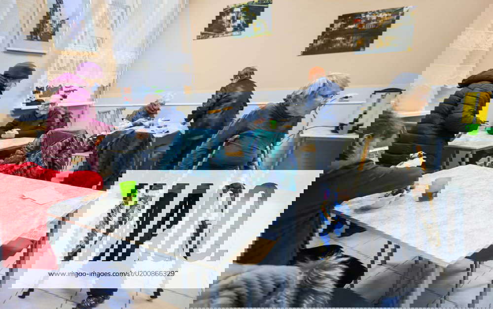 RUSSIA, ST PETERSBURG JANUARY 26, 2023 People have a meal in a soup kitchen of Malteser Relief