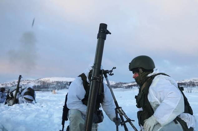 RUSSIA, MURMANSK REGION - JANUARY 7, 2024: A serviceman crosses himself ...