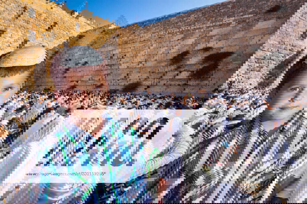 Jewish boy in yarmulke Jews praying at the Western Wall. The blessing ...