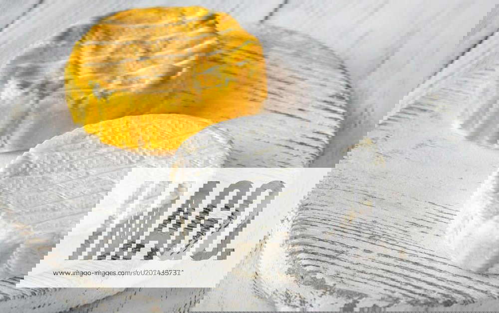 Camembert cheese, Two camembert cheese wheels on the cutting board, Two