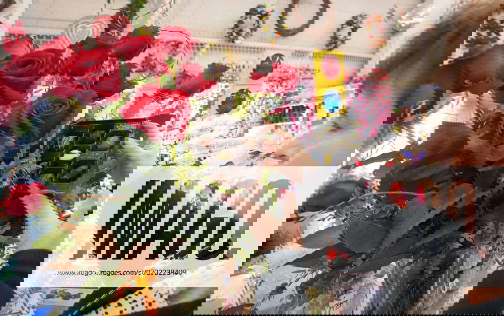 Robin Knoll places hand made chocolates into a display of roses at