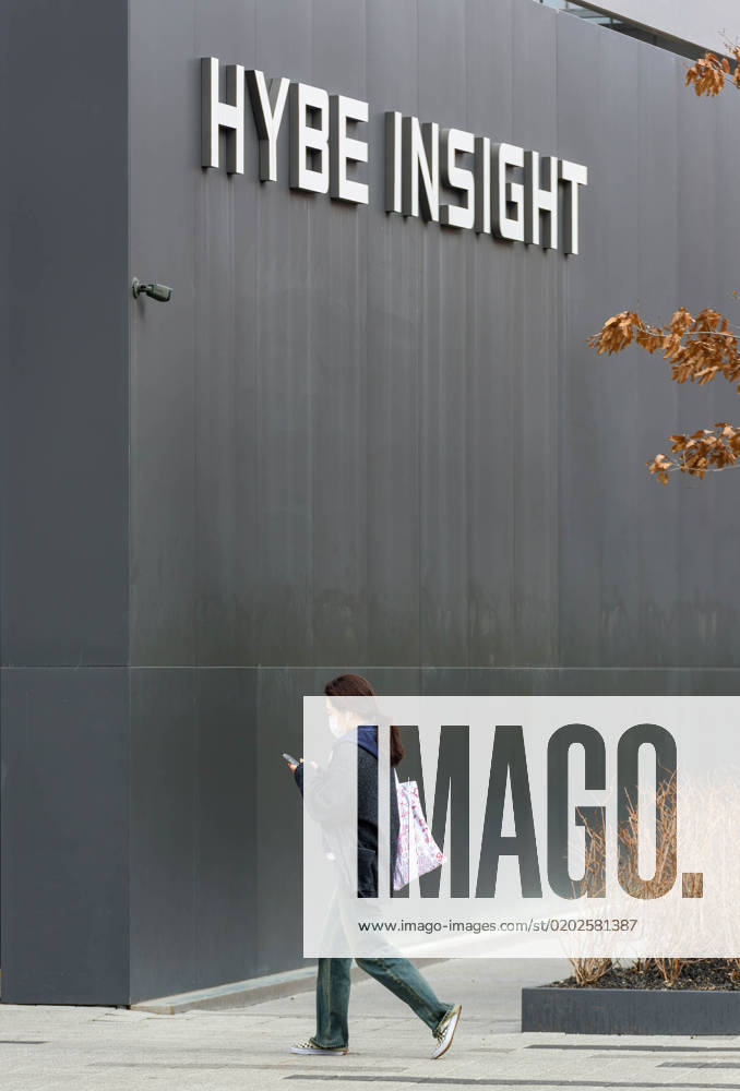 Hybe Address Seoul, South Korea: A woman walks past the Hybe headquarters building ...