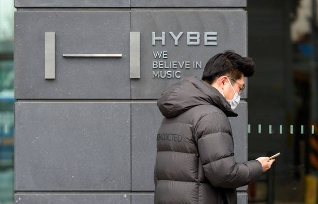 February 10, 2023, Seoul, South Korea: A woman walks past the Hybe ...