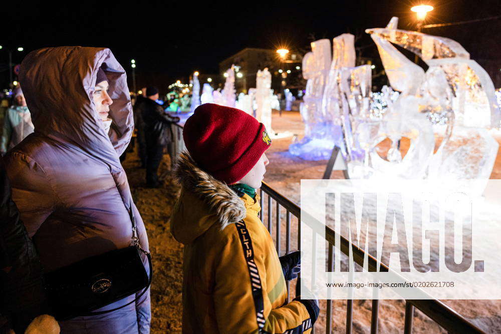 Russia, Petrozavodsk - February 11, 2023: People Look At Ice And Snow 