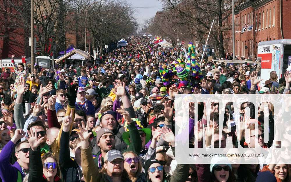Thousands crowd the streets to watch the St. Louis Mardi Gras Parade in