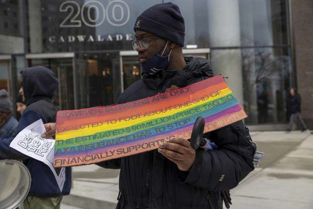 February 27, 2024, New York, New York, USA: A protester holds up his ...