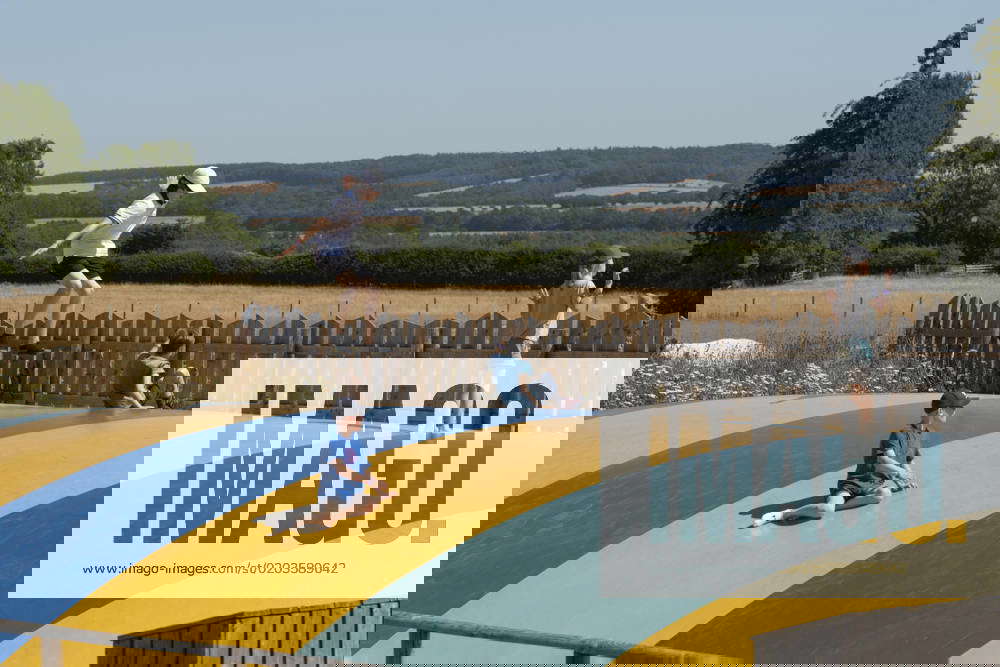 Cotswolds, Gloucestershire, England, UK, Children playing on a bouncy