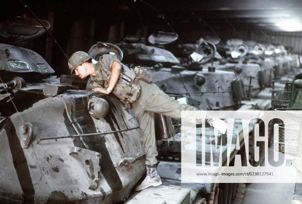 A member of the Army 34th Armor Division readies tanks for the ...