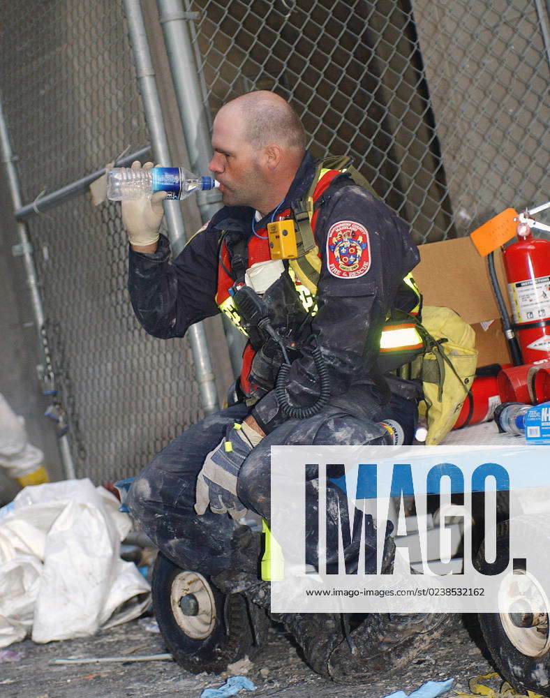 Taking a deep draught of water, a rescue worker from the Montgomery ...