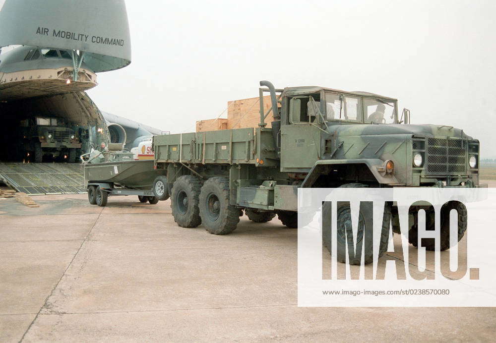 Marines from Small Craft Company guide an M923A1 cargo 5 Ton truck ...