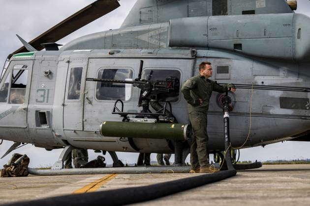 U.S. Marine Corps Lance Cpl. Bernard McPherson, a crew chief with ...