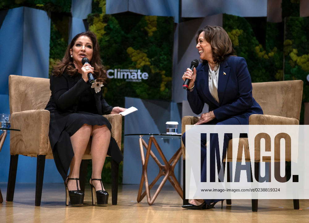 Vice President Kamala Harris (R) listens as songwriter Gloria Estefan ...