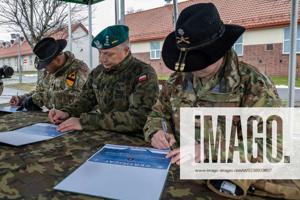 From left, U.S. Army Lt. Col. James Ray, incoming commander of NATO eFP ...