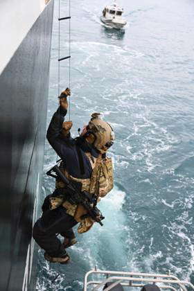 A Member from the Maritime Security Response Team (MSRT) West completes ...