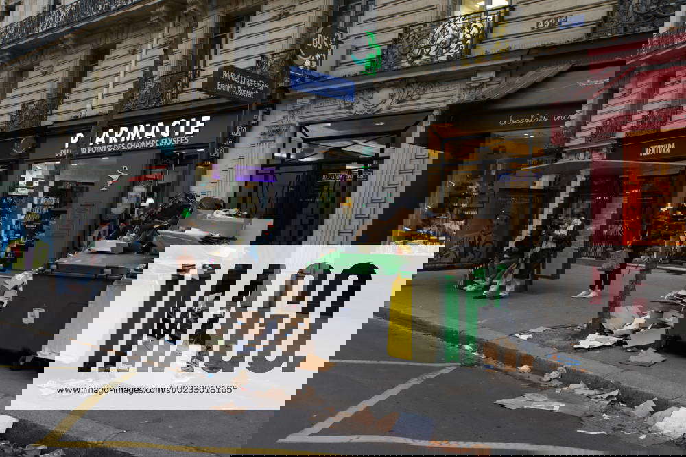 Rubbish bins overflow and pile up in the streets of the French capital