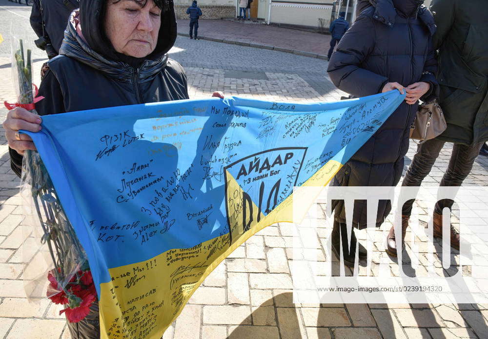 March 14, 2023, Kyiv, Ukraine A woman holds the flag of the Aidar