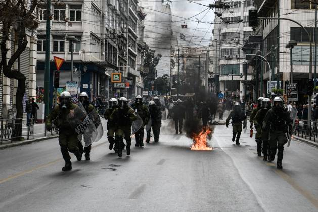Athens Tempi Riots Athens, Greece: Protesters throw petrol bombs at the riot police during ...