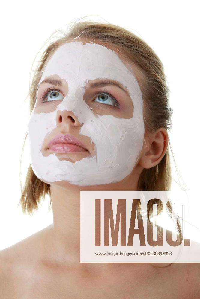 Cosmetics mask of clay on the young female face