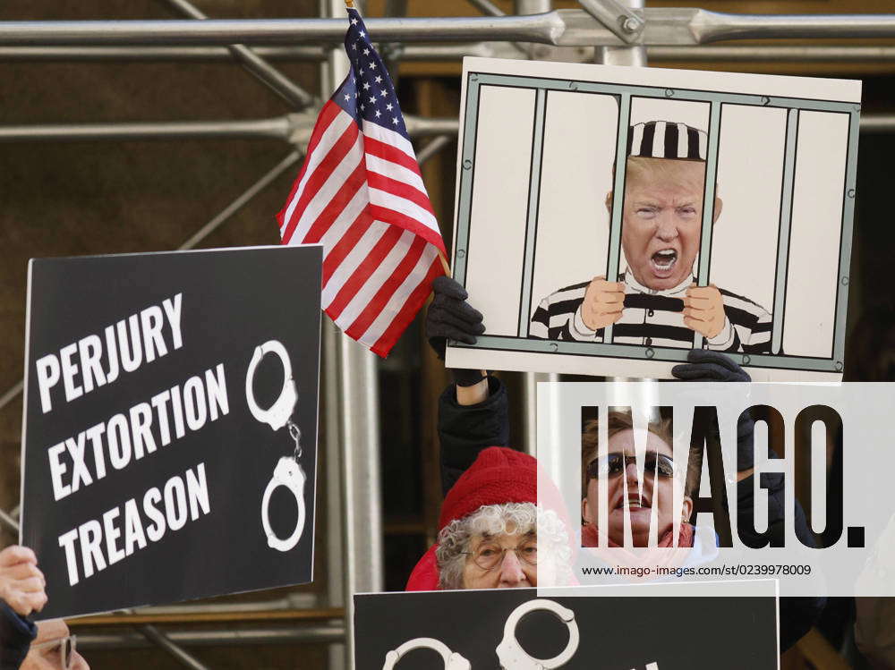 Protesters Hold Up Signs Outside Of New York State Manhattan District ...