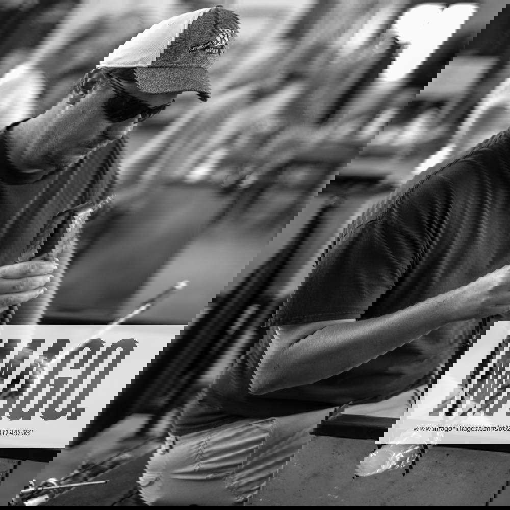 Glass Blowing LAKE WORTH, FL USA David Peterson shapes and molds a glass fabrication at Benzaiten