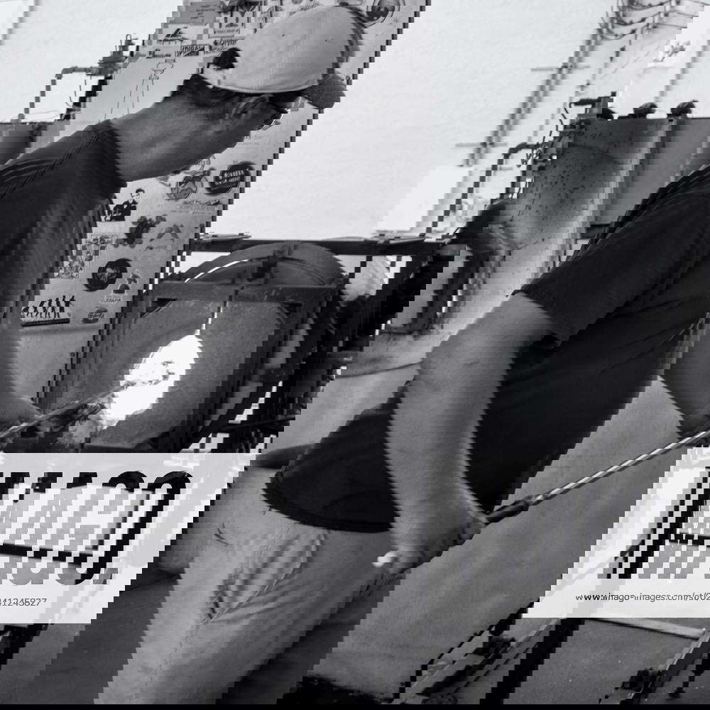 Glass Blowing LAKE WORTH, FL USA David Peterson reheats a glass fabrication in a furnace at