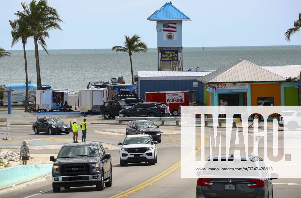 April 10, 2023, Fort Myers Beach, Florida, USA Cars stream across the