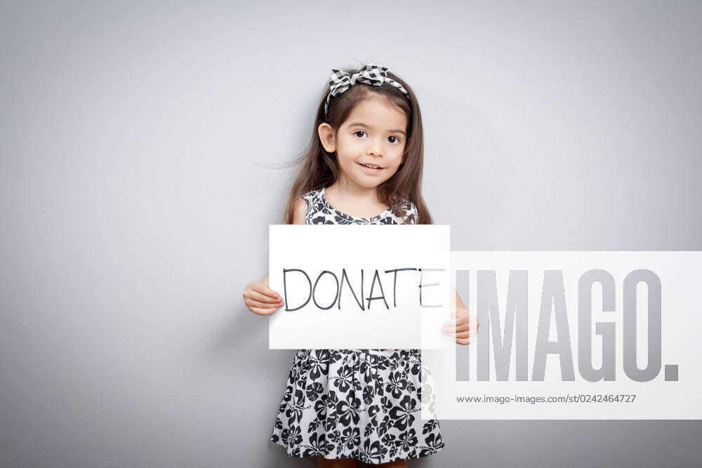 Little Cute Girl With Handwriting Text Donations On White Paper ...