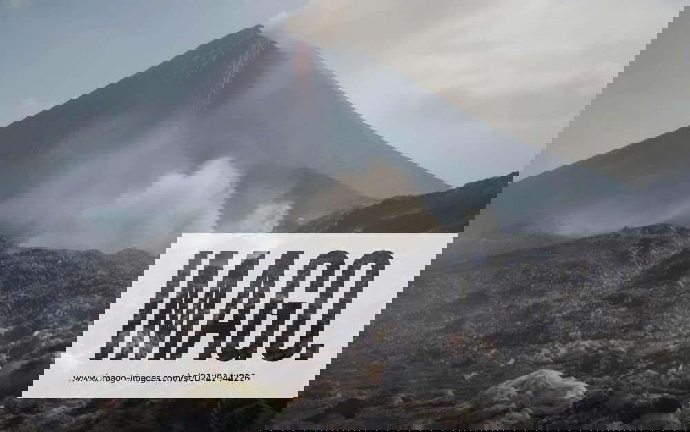 A large volcano and a huge amount of plastic waste on the landscape