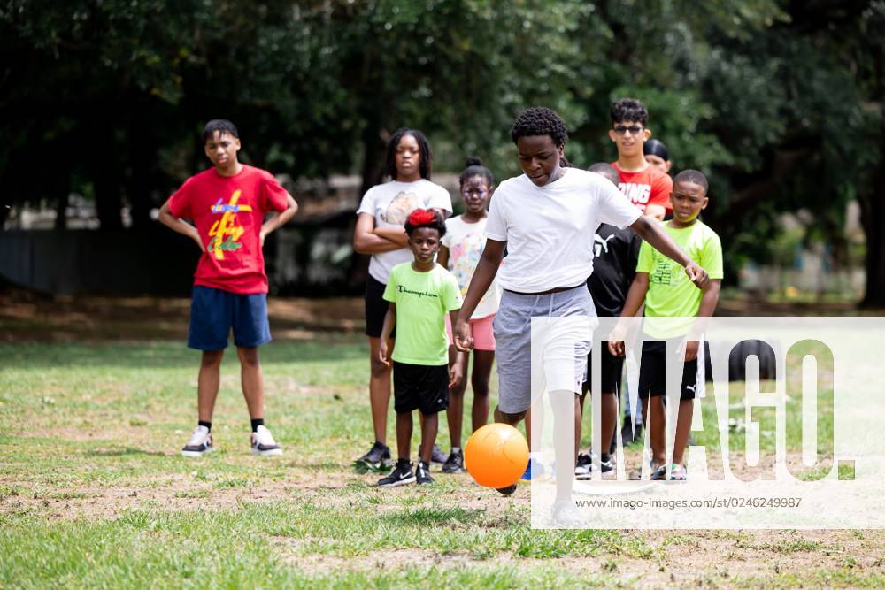 Syndication Gainesville Sun Festival goer Terence Shaw kicks the ball
