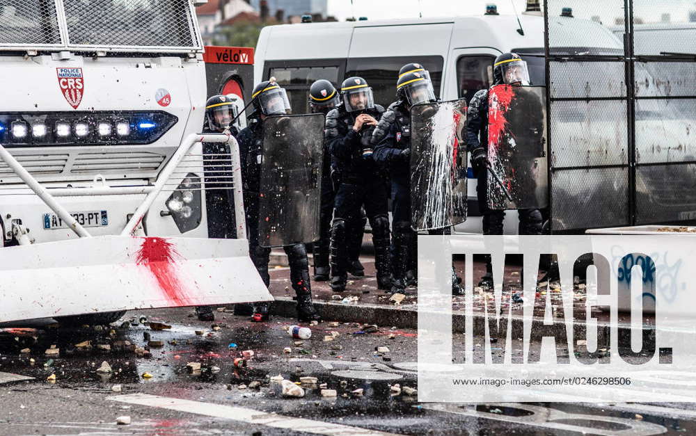 May Day Demonstration In Lyon, France Protesters face a water cannon ...