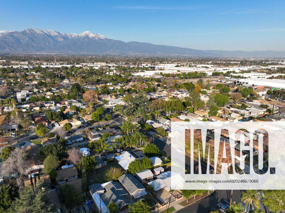 Aerial view of Ontario city in California with mountains in the ...