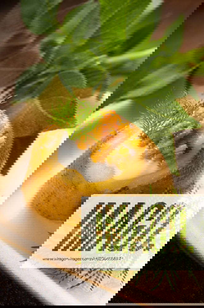 Baked potato with sour cream, grain Dijon mustard and herbs