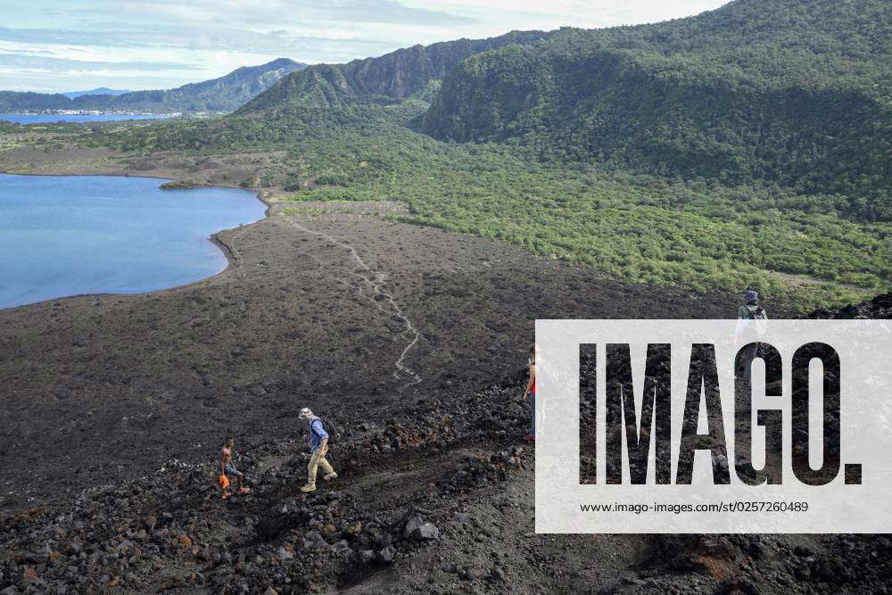 Hikers on still Assets Volcano Mount Tavurvur, Rabaul, East New Britain ...